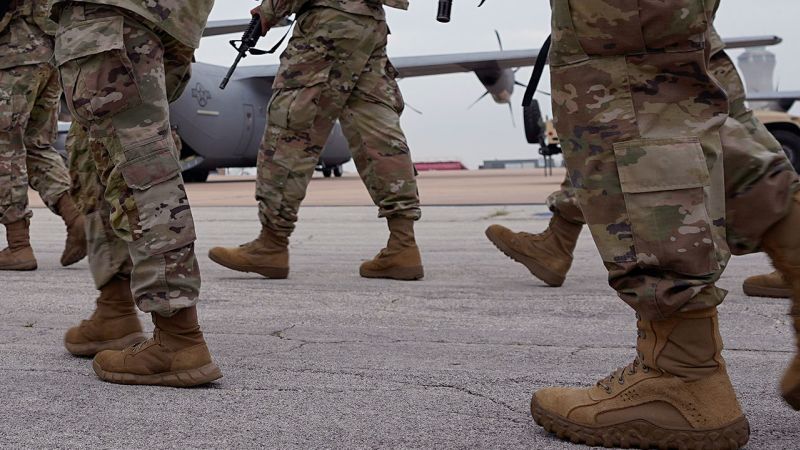 NextImg:Texas National Guard member says it's not clear how his gun discharged, shooting migrant | CNN