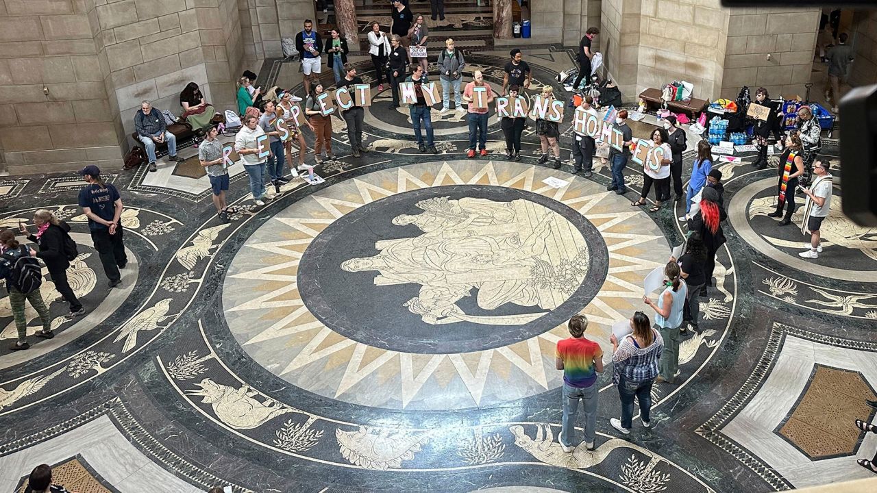 Protesters gather inside the State Capitol building on Friday, May 19, 2023, in Lincoln, Neb., before lawmakers were scheduled to begin debating a bill that will ban abortions at 12 weeks of pregnancy and also ban gender-affirming care for transgender minors. 