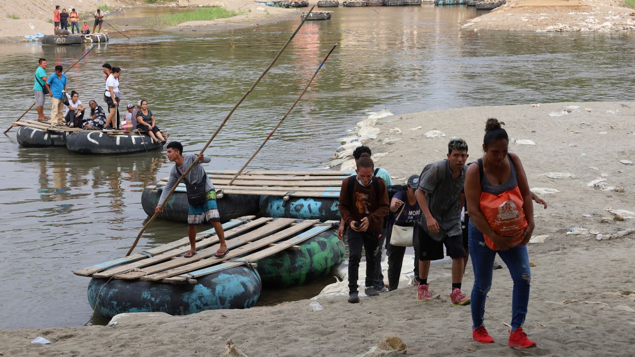 Migrants cross the Suchiate river, which marks the Guatemala-Mexico border, on May 9, 2023 in Ciudad Hidalgo, Mexico. 