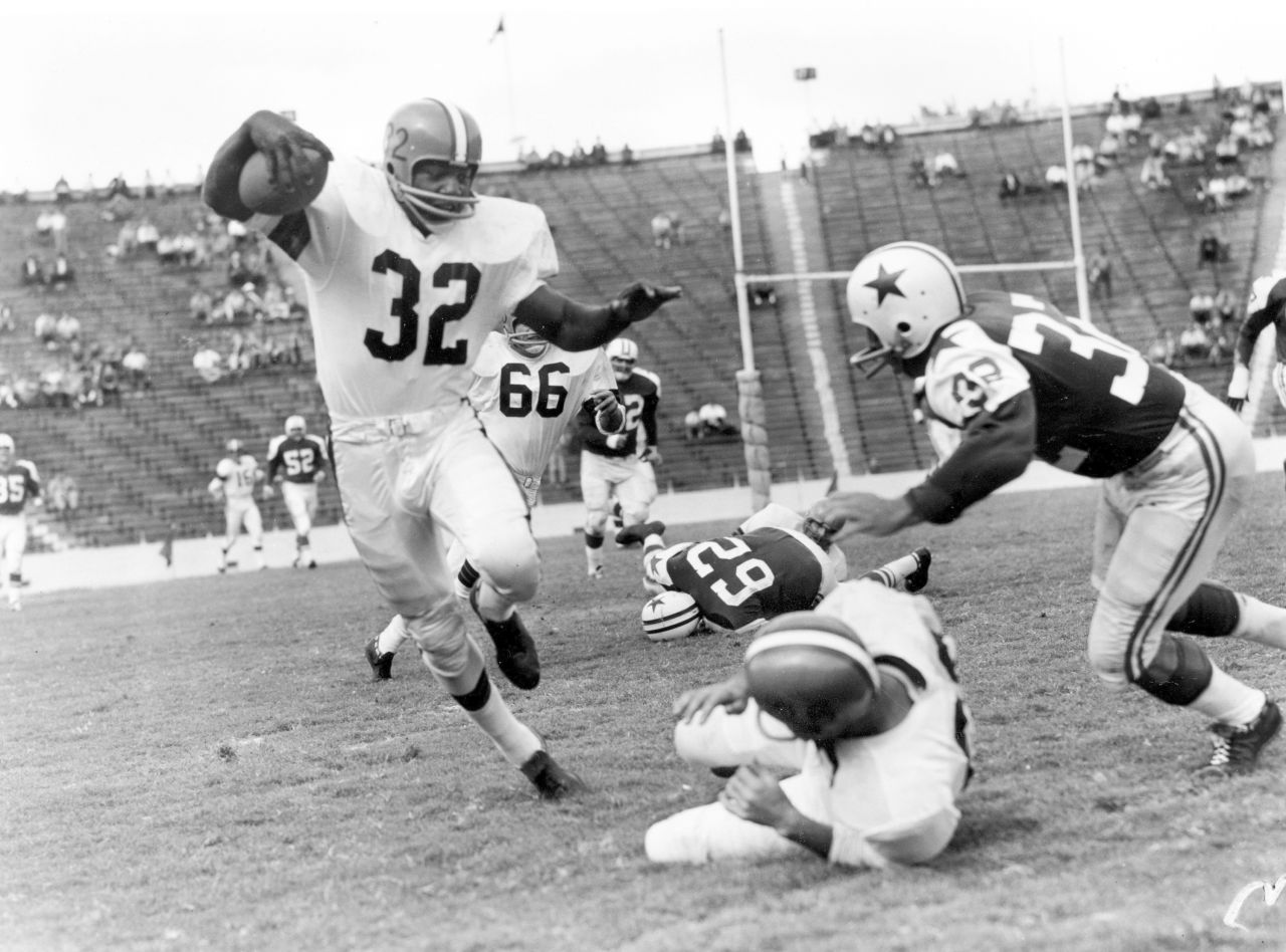 Brown runs during a game against Dallas in 1960. He led the league in rushing in eight of his nine seasons and was named MVP in 1957, 1958 and 1965.