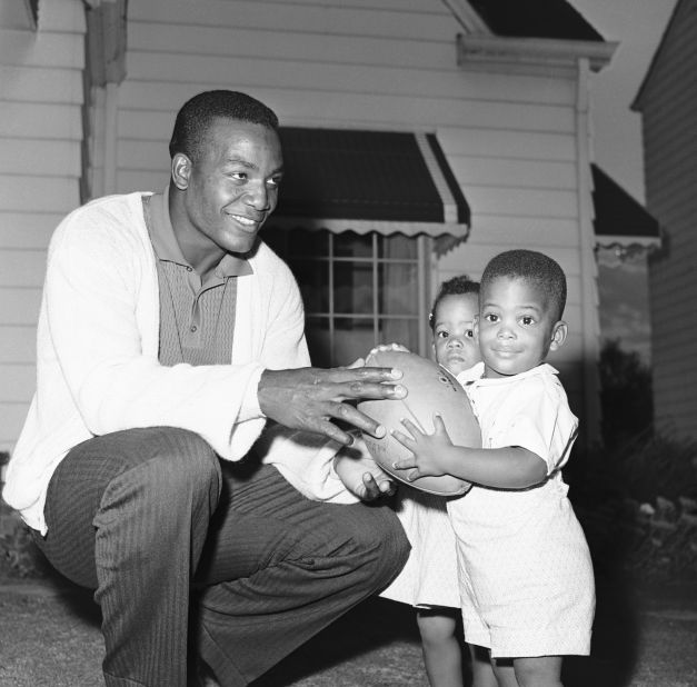 Brown plays with his twins Kevin and Kim in 1961.