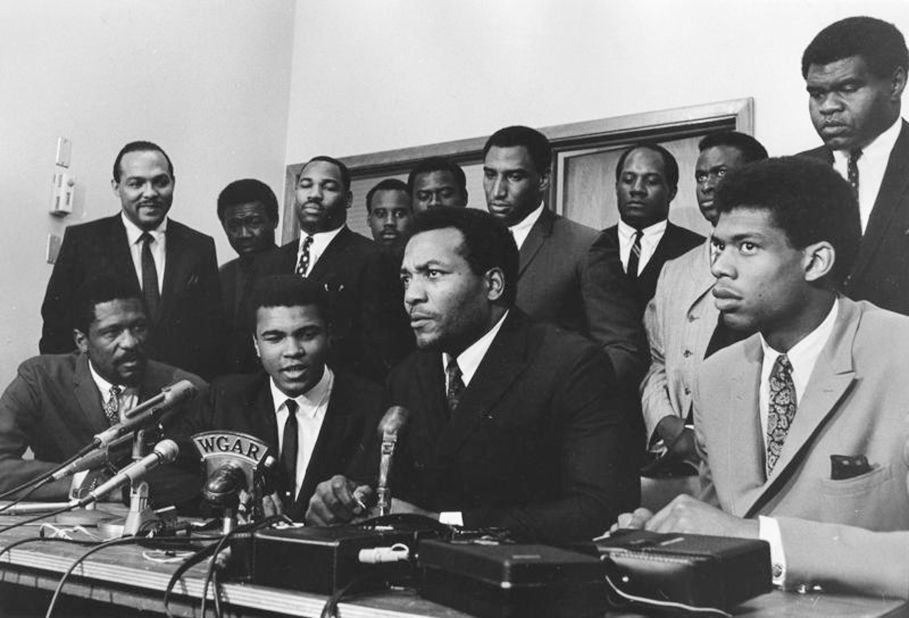Brown and other leading Black athletes offer support for boxer Muhammad Ali and his reasons for rejecting the draft during the Vietnam War in 1967. Seated from left are Bill Russell, Ali, Brown and Kareem Abdul-Jabbar.
