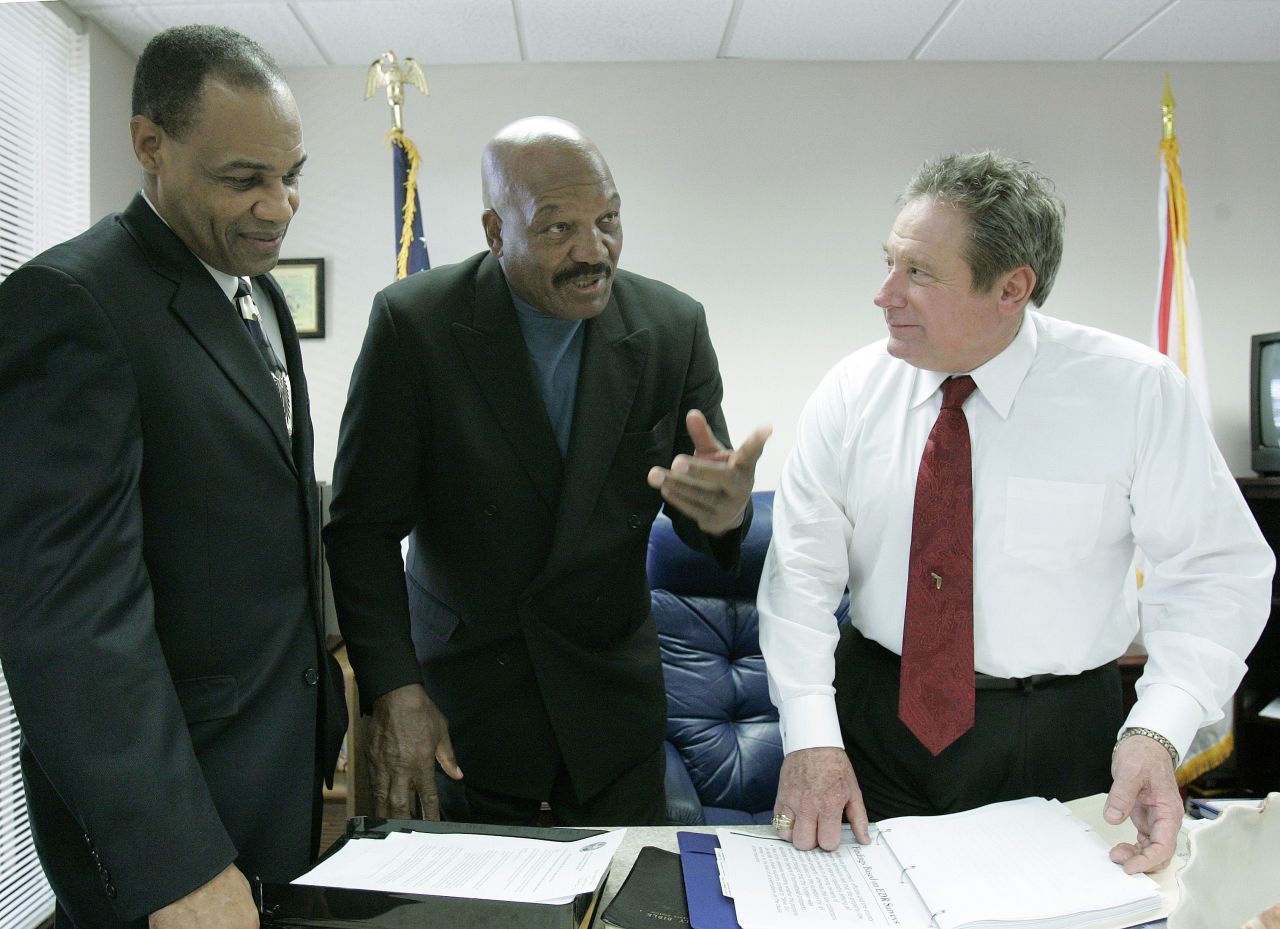 Brown talks with Florida Rep. Mitch Needelman, right, and Juvenile Justice Secretary Walt McNeil before meeting with the Florida House Committee on Juvenile Justice in 2007.   Brown addressed the committee regarding gang intervention and prevention.