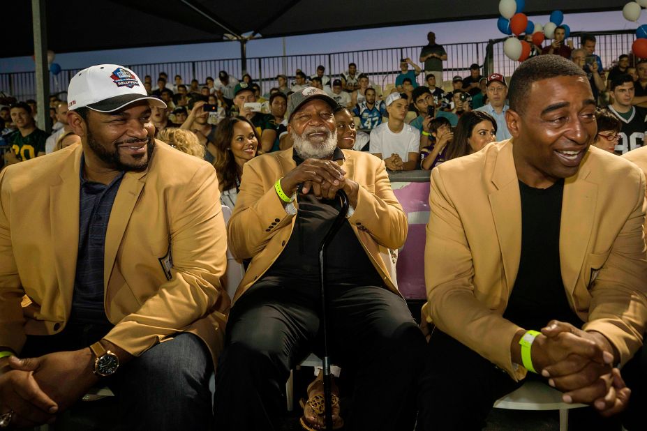 Brown, center, attends a football game in Israel along with NFL legends Jerome Bettis, left, and Cris Carter in 2017. Eighteen members of the Pro Football Hall of Fame were in the country to meet some of the 2,000 active players in Israel's various leagues.
