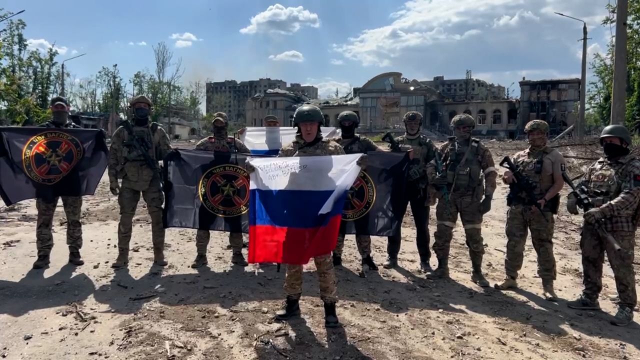 Yevgeny Prigozhin, the chief of the Wagner private military group, holds a Russian flag in this image from a video released on May 20, 2023.