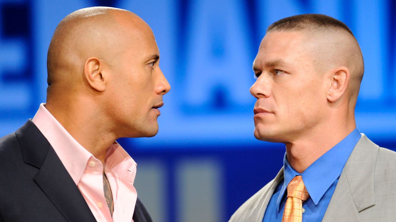 Dwayne "The Rock" Johnson, left, and John Cena locked in a stare down during a Wrestlemania XXVII news conference at the Hard Rock Cafe on Wednesday, March 30, 2011 in New York.