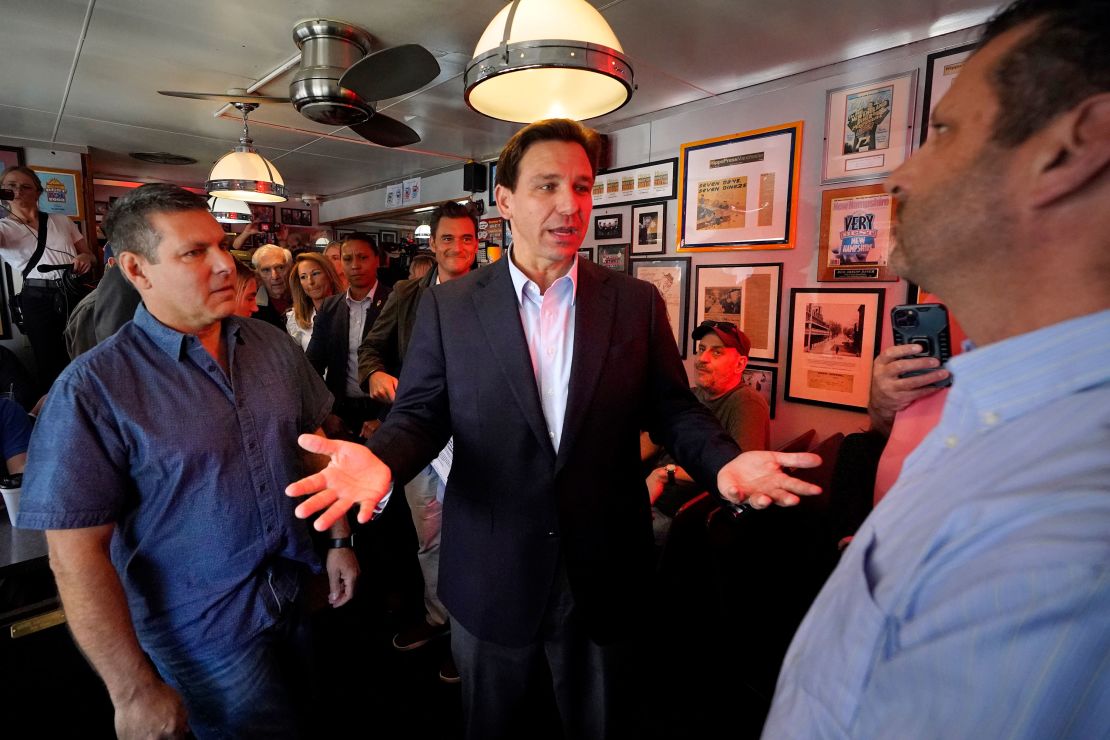 DeSantis speaks with patrons at a diner in Manchester, New Hampshire on May 19, 2023.