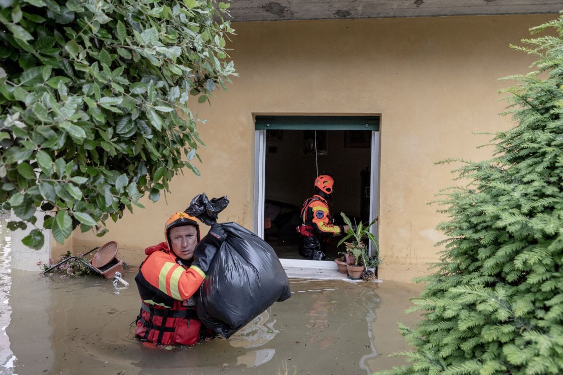 Firefighters come to rescue people and recover their belongings after flooding hit the Fornace Zarattini district of Ravenna in the Emilia Romagna region of Italy on May 20.
