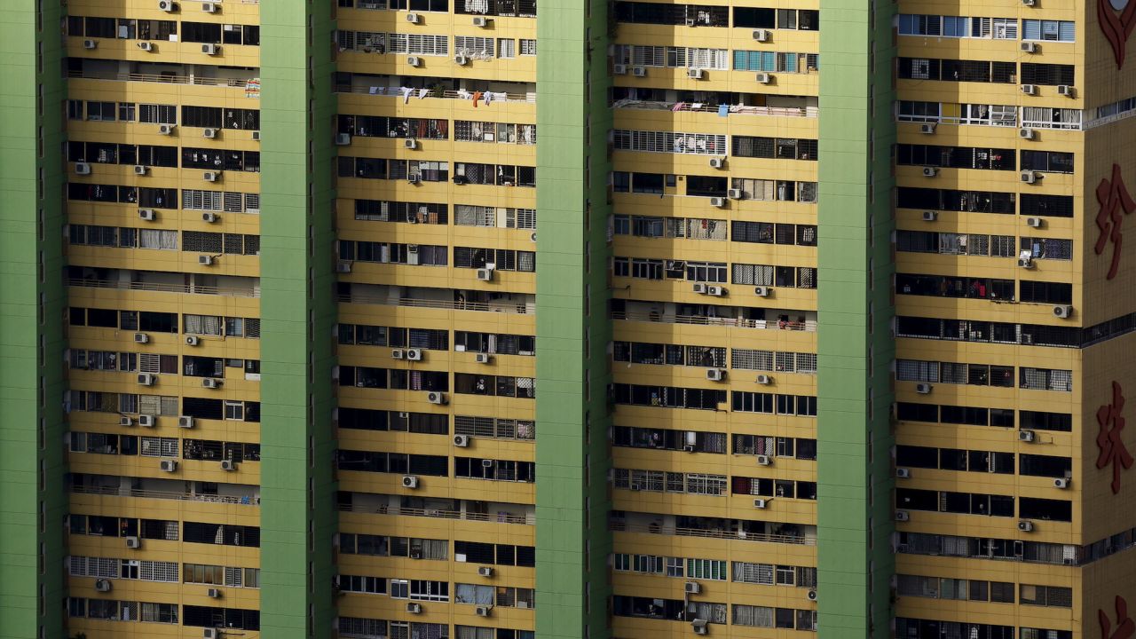 Air-conditioning units dot the facade of an apartment building in Singapore's Chinatown.