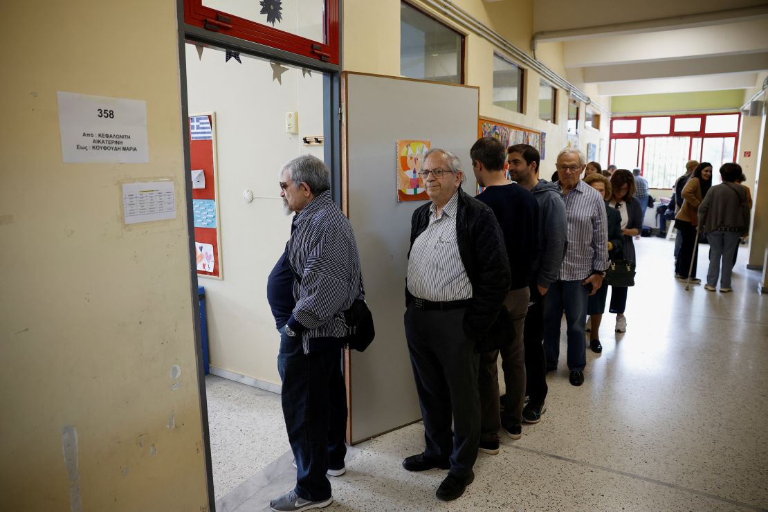 People queue to vote at a polling station in Athens, Greece on May 21, 2023. 