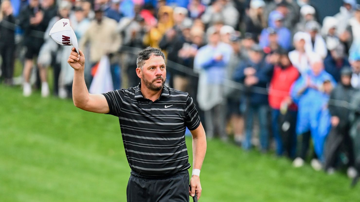 PGA Professional Michael Block tips his cap to fans on the 18th hole after carding a 70 during the third round of the 2023 PGA Championship at Oak Hill Country Club in Rochester, New York.