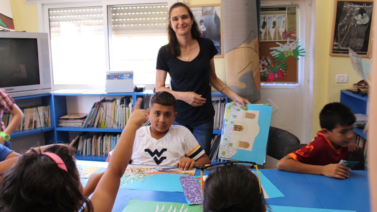 Amahl Bishara helps Palestinian children at Aida Refugee Camp create an alphabet book about their childhood.