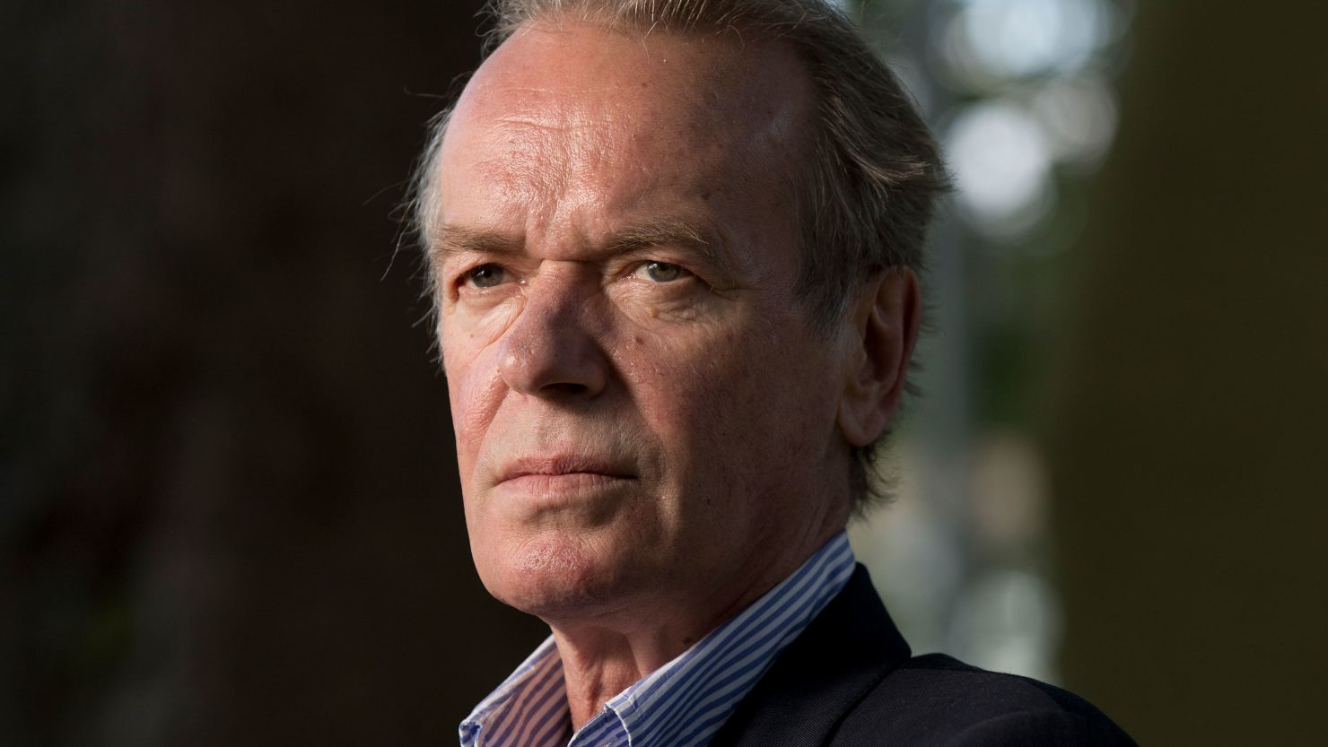 Legendary, bestselling British author Martin Amis, pictured at the Edinburgh International Book Festival where he talked about his new novel entitled 'The Zone of Interest'. The three-week event is the world's biggest literary festival and is held during the annual Edinburgh Festival. The 2014 event featured talks and presentations by more than 500 authors from around the world and was the 31st edition of the festival. (Photo by Colin McPherson/Corbis via Getty Images)