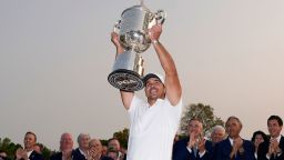 Brooks Koepka holds the Wanamaker trophy aloft after winning the PGA Championship at Oak Hill Country Club in Rochester, New York.