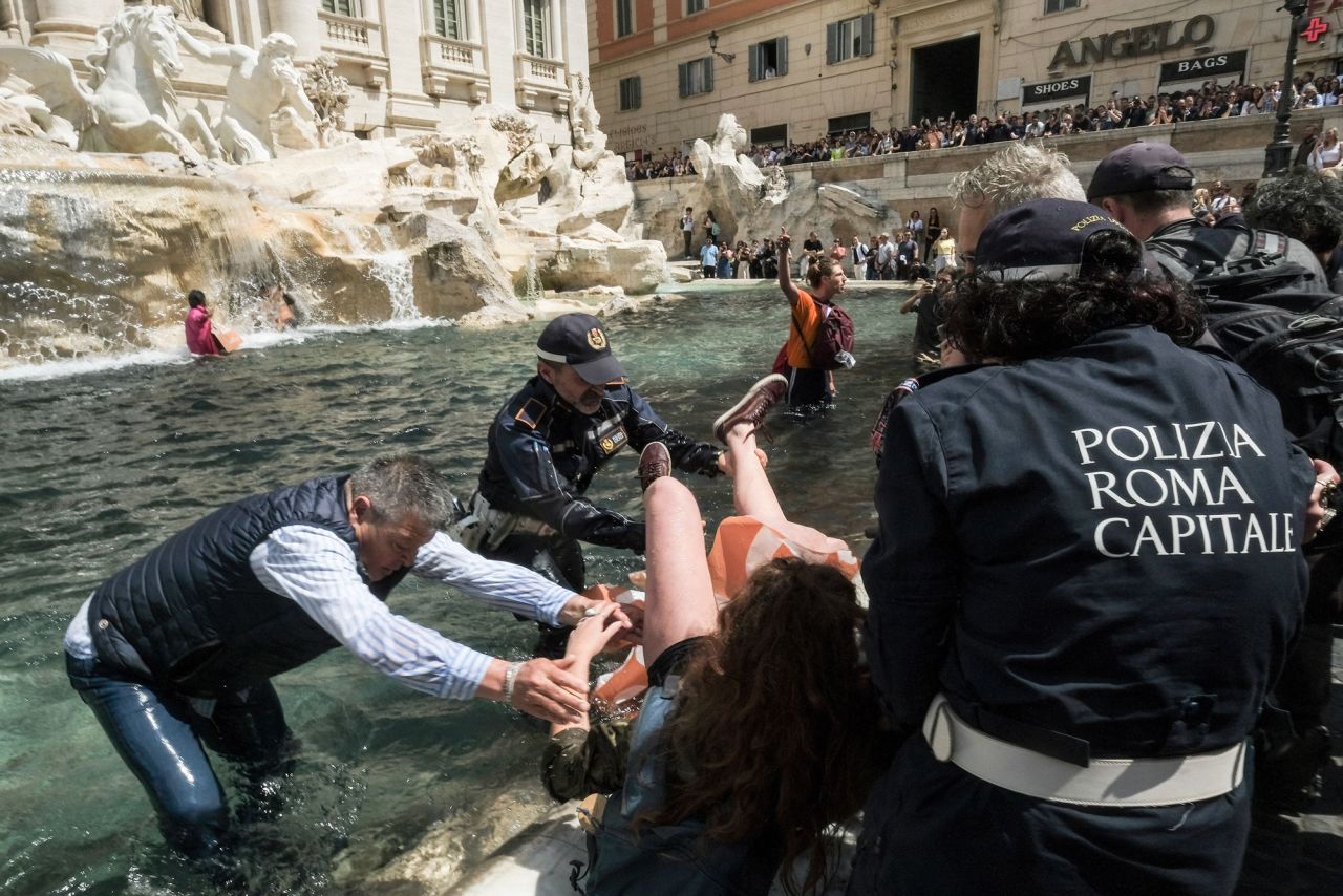 Last Generation activists at the Trevi Fountain, Rome.