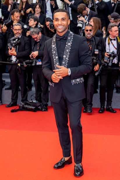 British actor Lucien Laviscount arrived at the "Killers Of The Flower Moon" screening in a crystal-embellished Dolce & Gabanna suit.