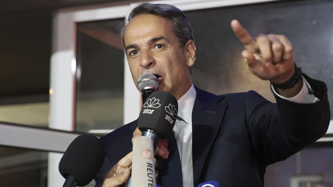 Leader of the ruling New Democracy (ND) party and Prime Minister Kyriakos Mitsotakis addresses supporters at the party's headquarters in Athens after preliminary official results released on May 21, 2023.