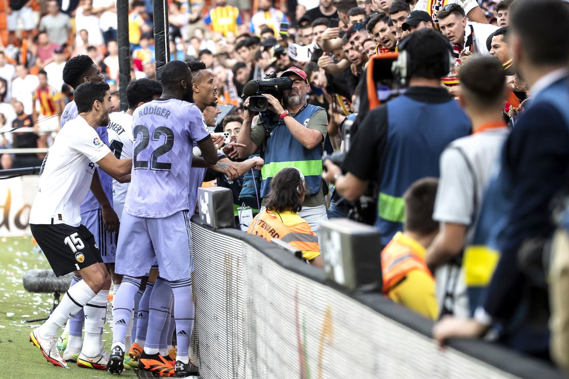Vinícius Jr. and  Antonio Rudiger confront fans during Real Madrid's game against Valencia.