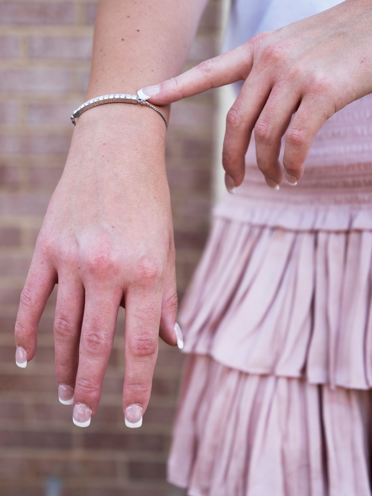 A student flaunts her bracelet during recruitment at the University of Alabama in 2022. 