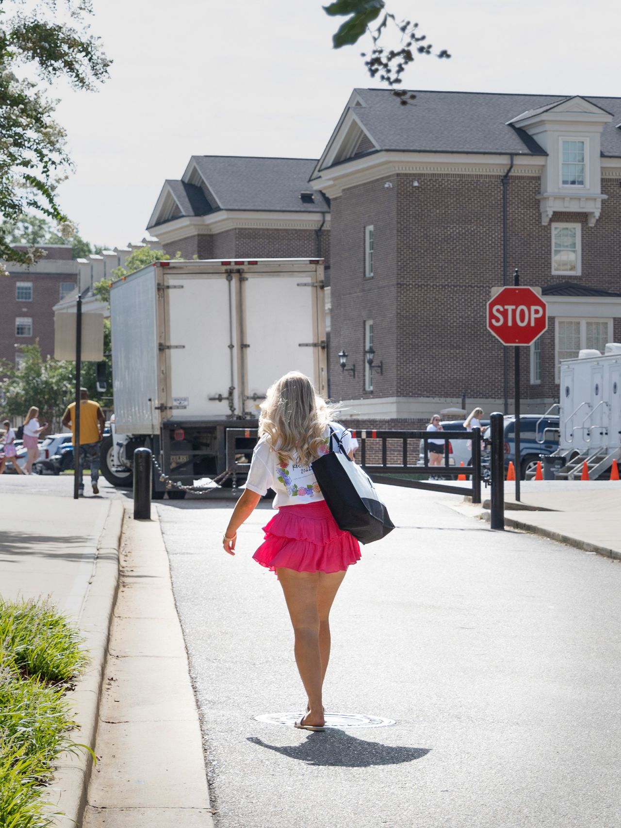 A potential new member walks around the University of Alabama's Sorority Row during recruitment week in 2022. 