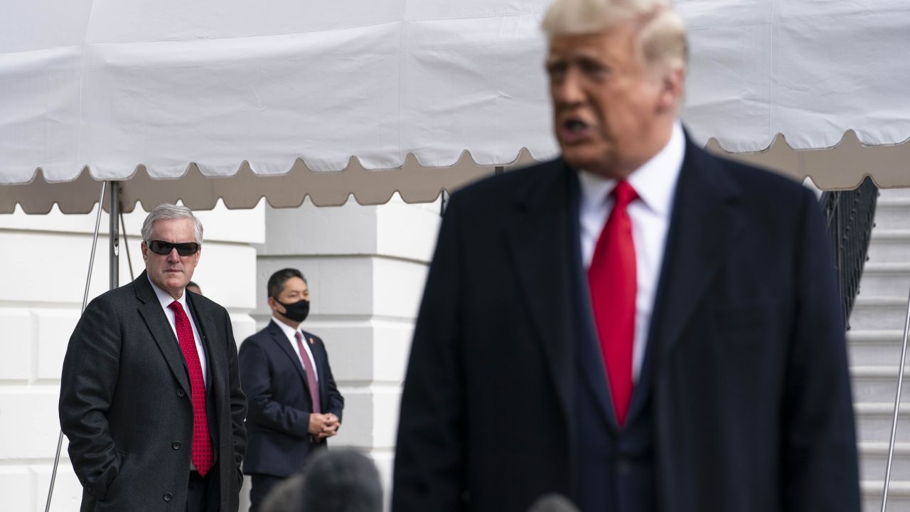 Meadows listens as President Donald Trump speaks to the press outside the White House on October 30, 2020