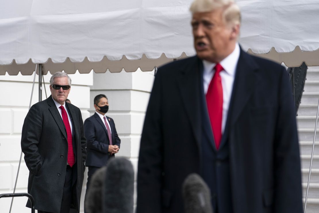 Meadows listens as President Donald Trump speaks to the press outside the White House on October 30, 2020