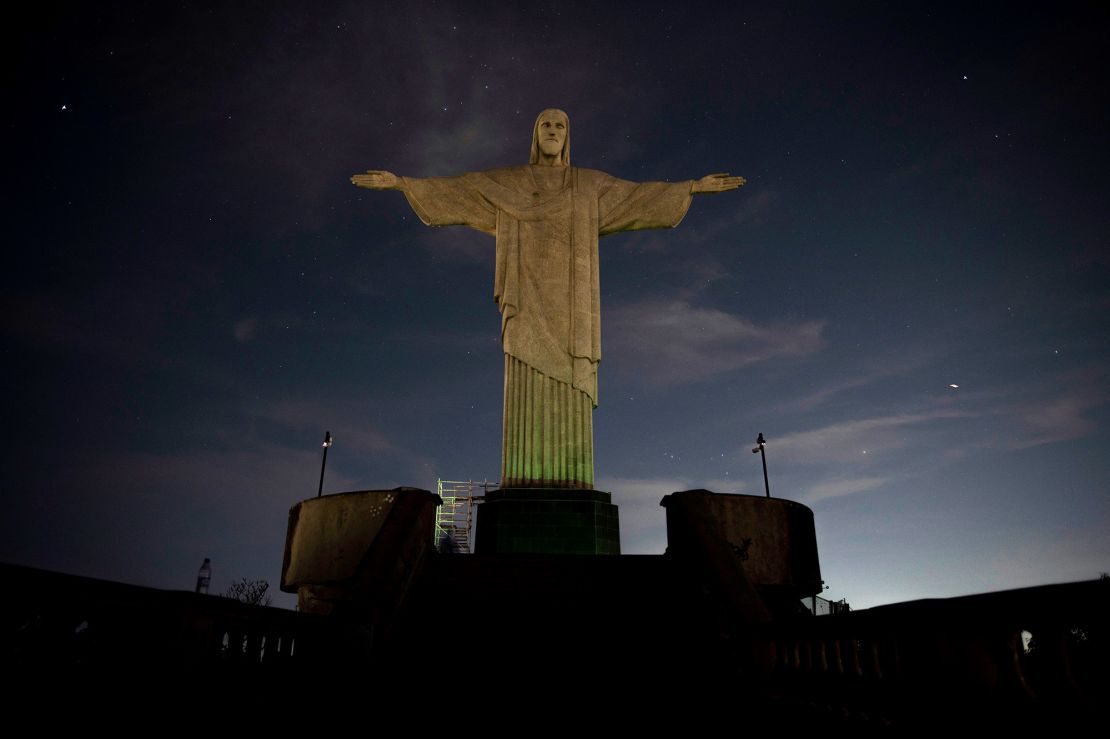 The Christ the Redeemer statue is seen without illumination to condemn racist acts against Vinícius in Rio de Janeiro on May 22.