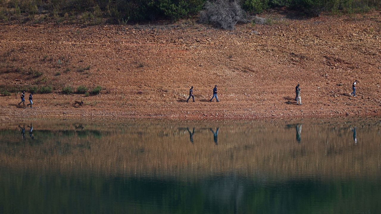 Portuguese authorities during a new search operation at the Arade dam, in Silves, near Praia da Luz, on May 23.