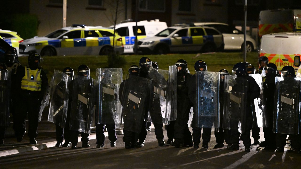 Police cordon off the scene of a car crash in Cardiff on May 23, 2023 after rioters poured into the streets of the Welsh capital.