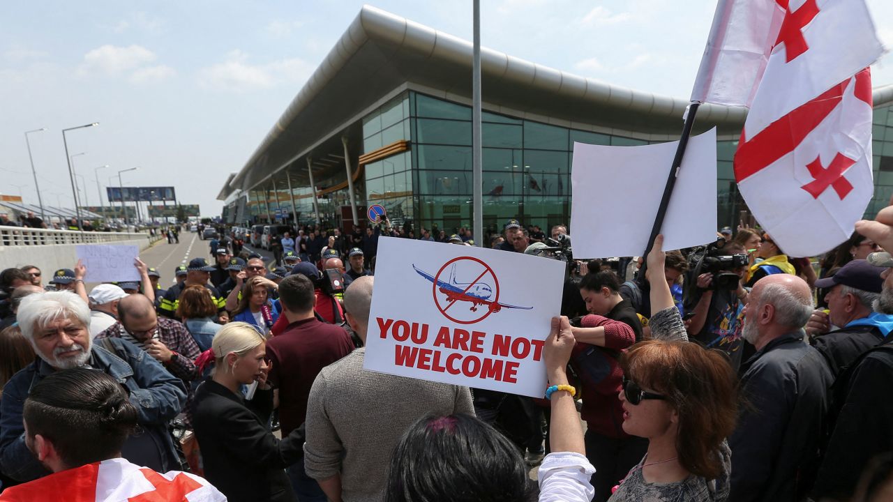Crowds gathered outside Tbilisi Airport to protest the resumption of direct flights from Moscow, on May 19.