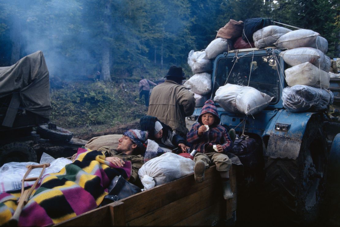 Refugees ride a tractor during the exodus of people after Russia invaded Abkhazia in the early 1990s. Dzvelaia's family fled at the same time.