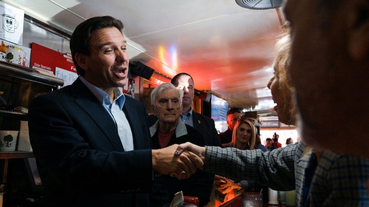 Florida Gov. Ron DeSantis greets people at a diner in Manchester, New Hampshire, on May 19, 2023.