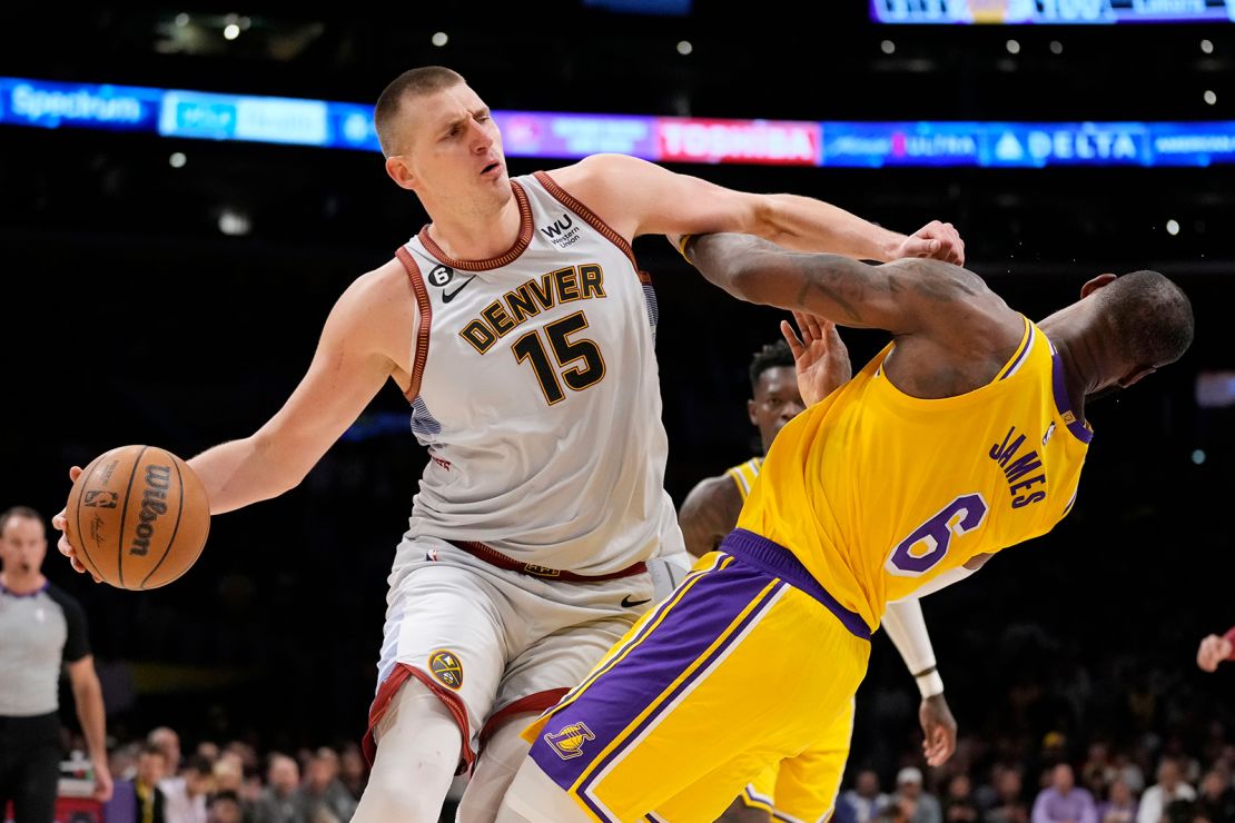 Denver Nuggets center Nikola Jokic  collides with Los Angeles Lakers forward LeBron James in the second half of Game 4.