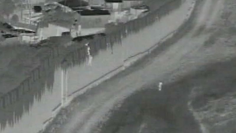 NextImg:A 4-year-old boy was dropped over a border barrier in San Diego. Agents who rushed to help came under fire | CNN