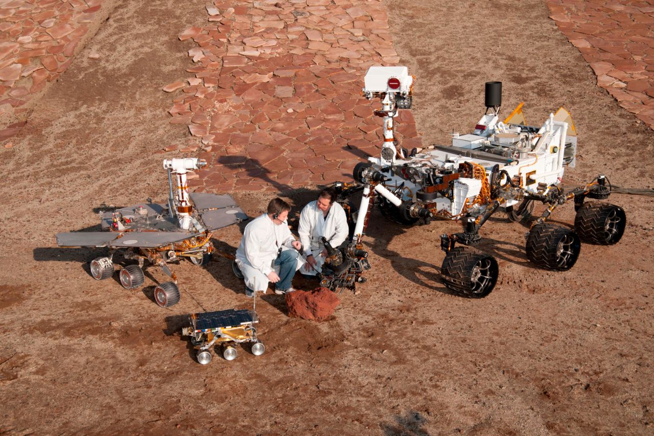 Lunar rovers offer insight into what's possible for rovers on Mars. Here engineers Matt Robinson, left, and Wesley Kuykendall, are pictured with three generations of Mars rovers developed at NASA's Jet Propulsion Laboratory, Pasadena.