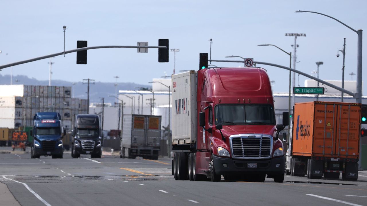 Trucks drive through the Port of Oakland on March 31, 2023 in Oakland, California. 