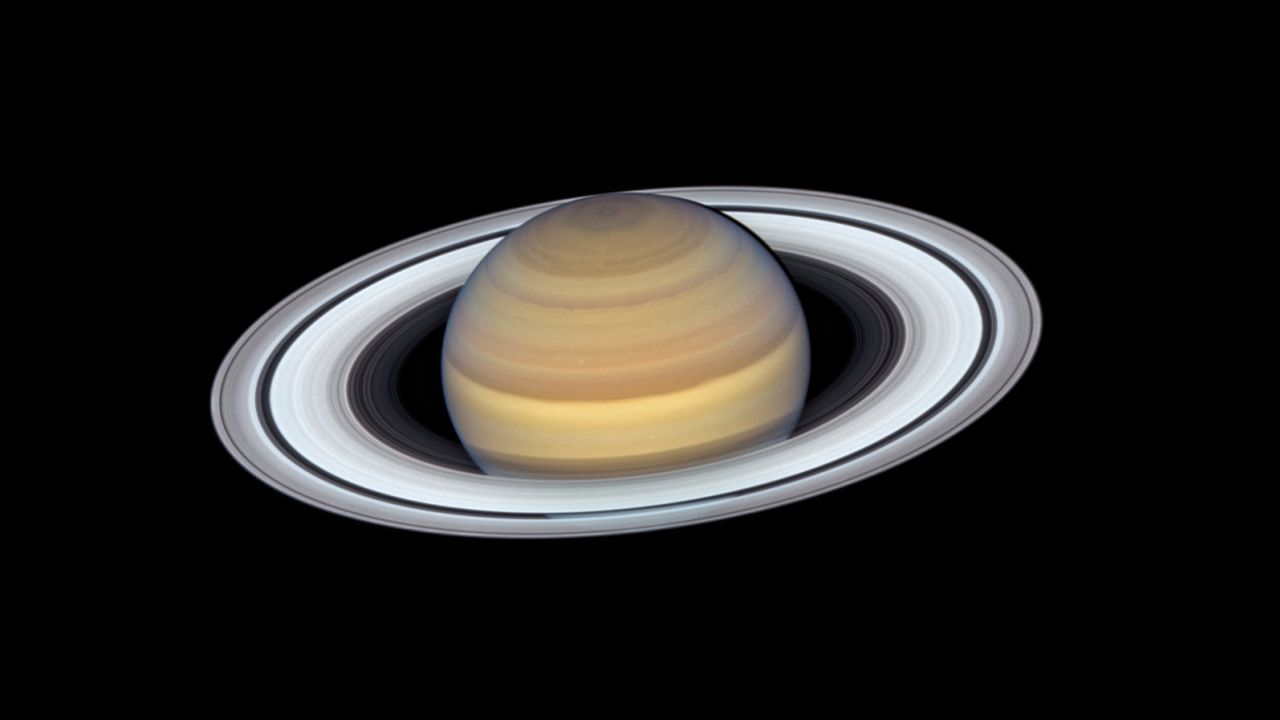 The latest view of Saturn from NASA's Hubble Space Telescope captures exquisite details of the ring system — which looks like a phonograph record with grooves that represent detailed structure within the rings — and atmospheric details that once could only be captured by spacecraft visiting the distant world.