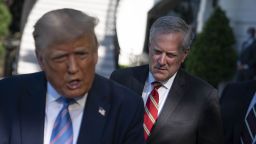 Mark Meadows, White House chief of staff, listens as U.S. President Donald Trump, left, speaks to members of the media before boarding Marine One on the South Lawn of the White House in Washington, D.C., U.S., on Wednesday, July 29, 2020. Trump will look to deep-pocketed energy barons to help jump start his sputtering re-election campaign today during a stop in Texas, a traditional Republican bastion that has become increasingly competitive for Democrats.