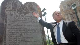 AUSTIN, TX - JUNE 27: Texas Attorney General Greg Abbott attends a press conference celebrating the U.S. Supreme Court decision that allows a Ten Commandments monument to stand outside the Texas State Capitol June 27, 2005 in Austin, Texas. A sharply divided Supreme Court upheld the constitutionality of displaying the Ten Commandments on government land, but drew the line on displays inside courthouses, saying they violated the doctrine of separation of church and state. (Photo by Jana Birchum/Getty Images)