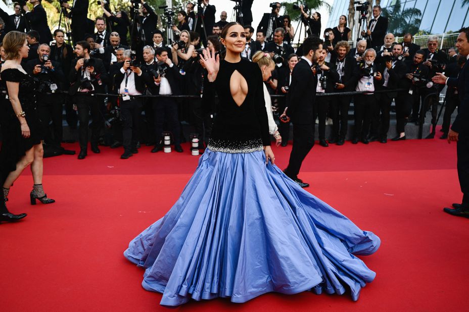Model Olivia Culpo opted for a gown from Miss Sohee couture that features a velvet bodice with a dramatic cut-out, an embellished waistline and a bold pleated periwinkle skirt.