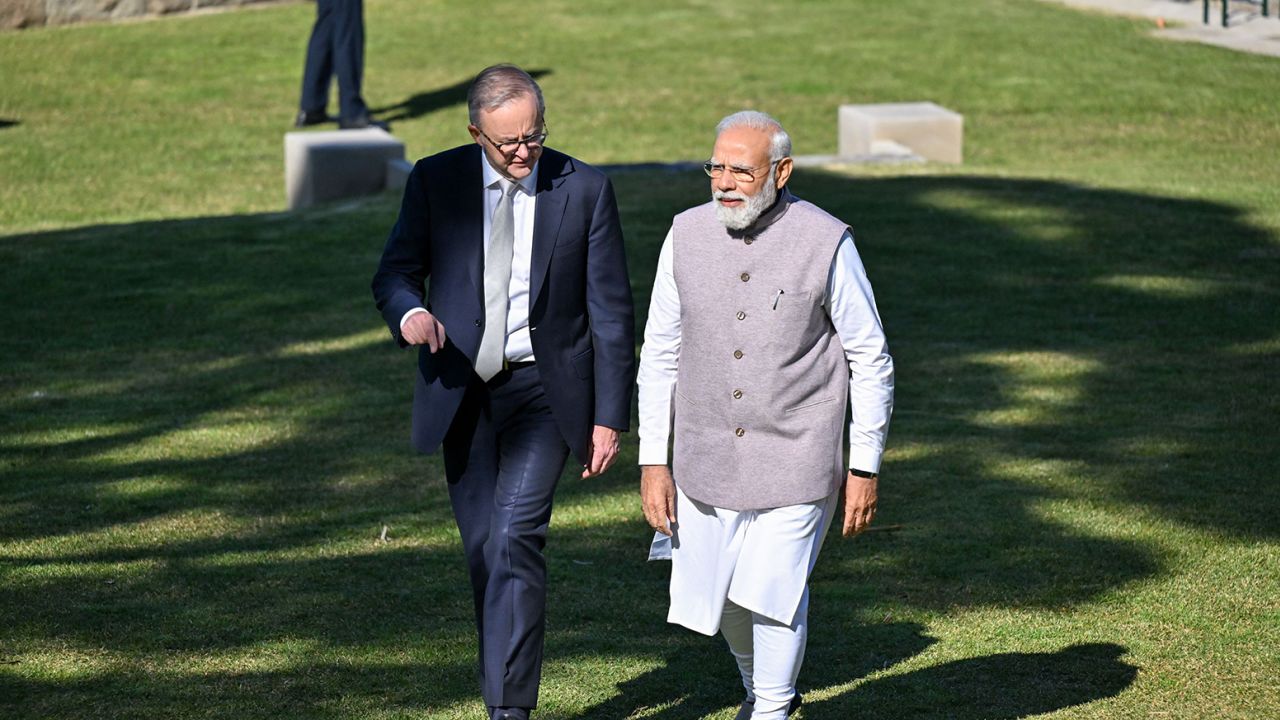 Modi walks with Australia's Prime Minister Anthony Albanese at Admiralty House in Sydney on May 24, 2023.