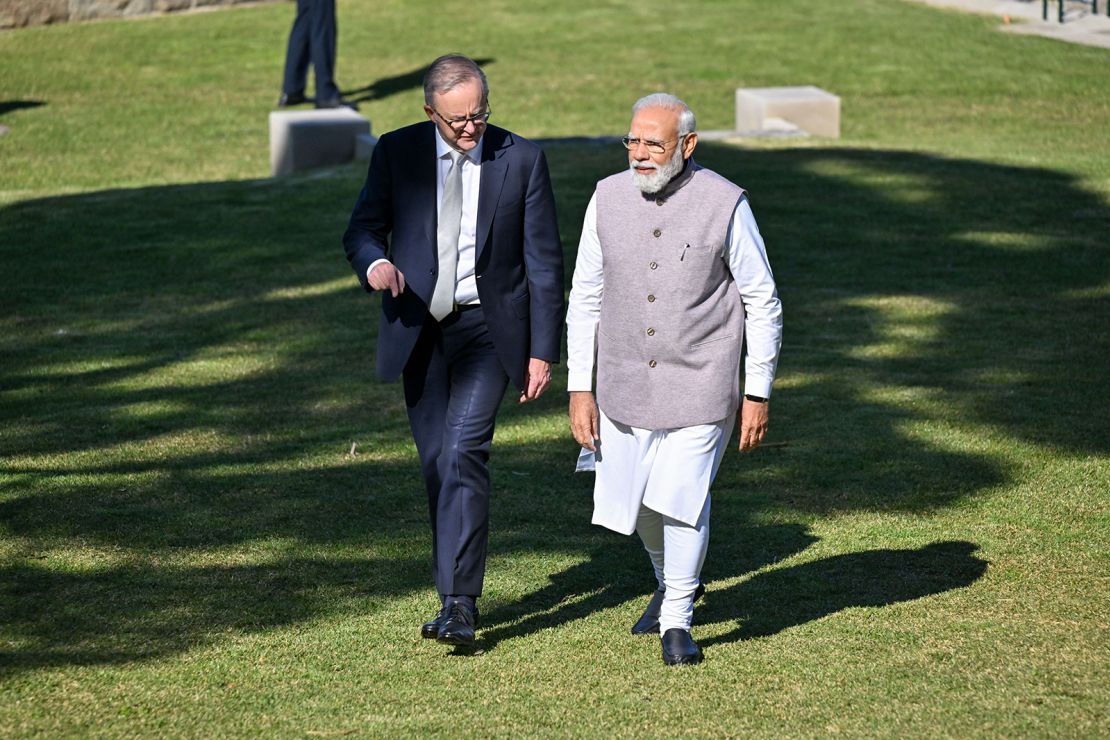 Modi walks with Australia's Prime Minister Anthony Albanese at Admiralty House in Sydney on May 24, 2023.
