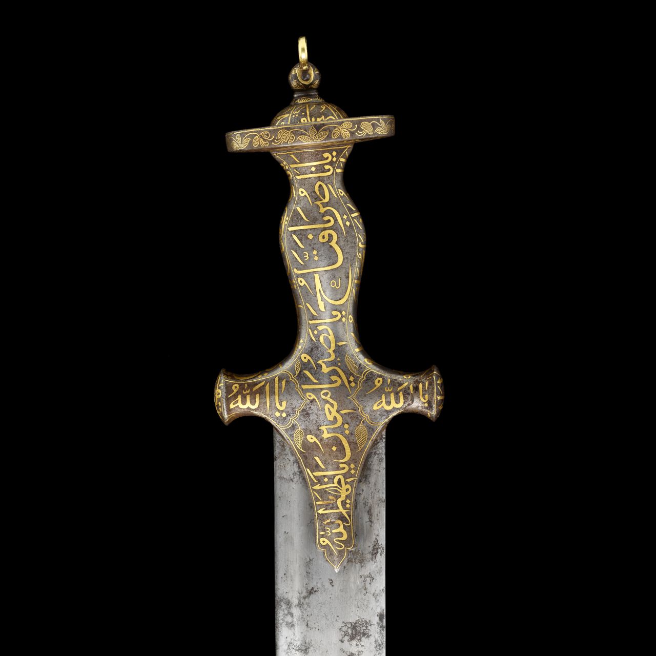 The hilt of the sword is decorated with fine gold calligraphy. 