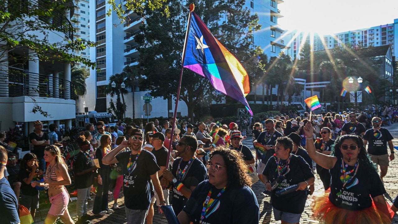 People attend a Pride Parade in Orlando, Florida, on October 15, 2022.