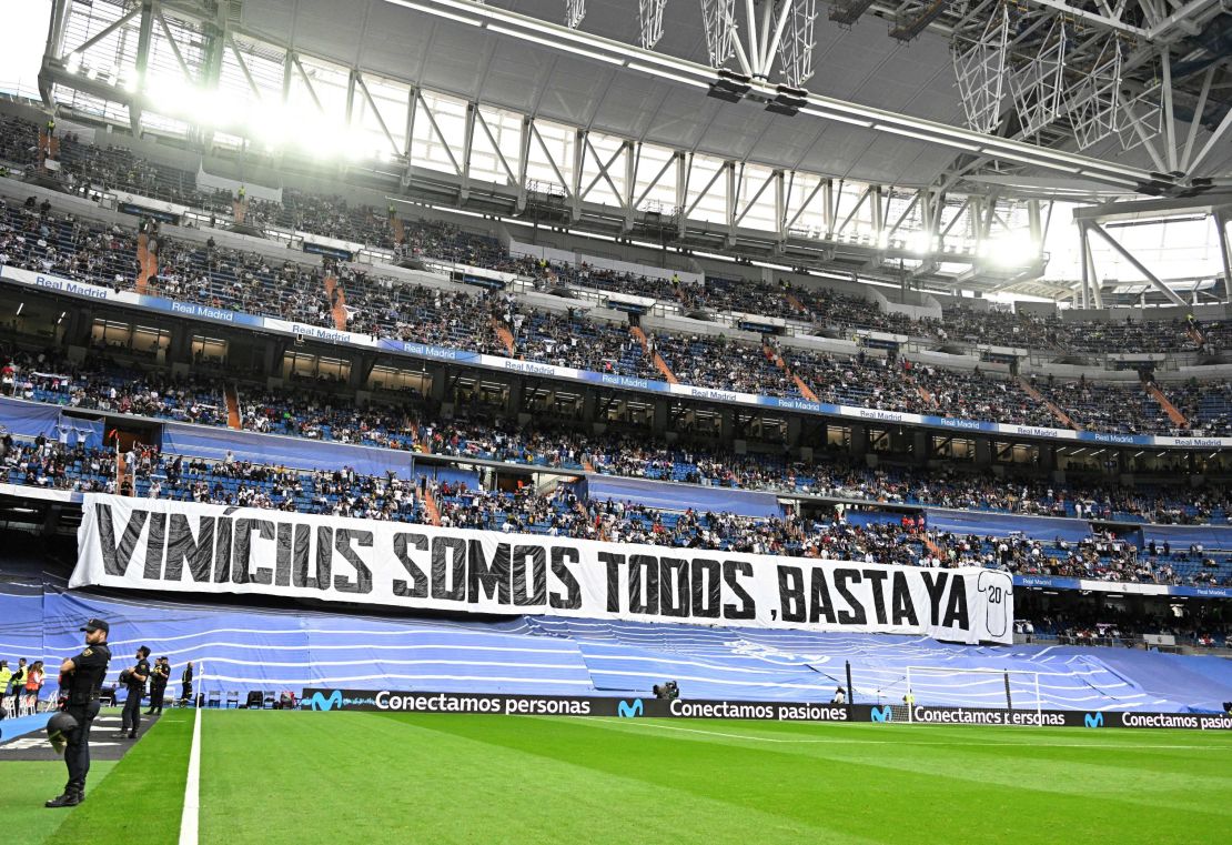 Real Madrid fans hold up a banner reading "We're all Vinícius. Enough" before the game against Rayo Vallecano.