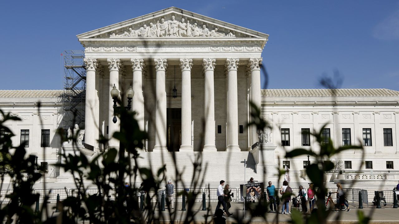 People visit the front of the U.S. Supreme Court Building on April 19, 2023 in Washington, DC.