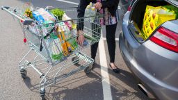 A shopper loads groceries into a car in Sheffield, UK, on Friday, May 19, 2023. 