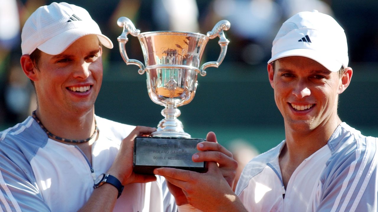 United States twins Bob, left, and Mike Bryan, both from Camarillo, Ca.,  hold their trophy after winning the men's double final against Netherland's Paul Haarhuis and Russia's Yevgeny Kafelnikov in the French Open tennis tournament at Roland Garros stadium in Paris, Saturday, June 7, 2003. (AP Photo/Christophe Ena)