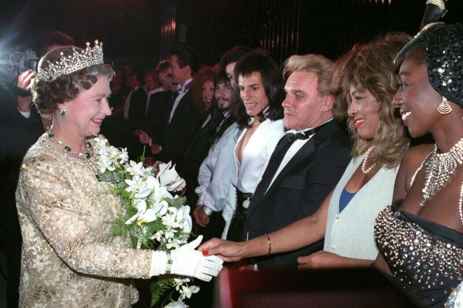 Britain's Queen Elizabeth II shakes Turner's hand after a performance in London in 1989.