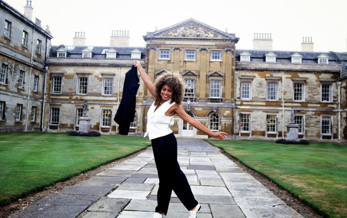 Turner poses in front of Woburn Abbey as she tours England in 1990.